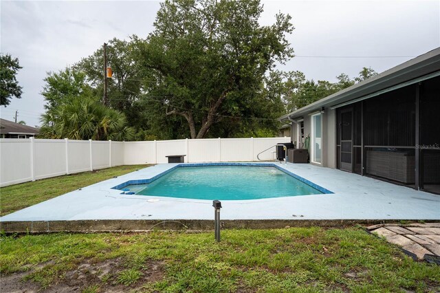 21220 Pemberton Ave, Port Charlotte, FL 33952 - view of pool with a patio area, a fenced backyard, and cooling unit