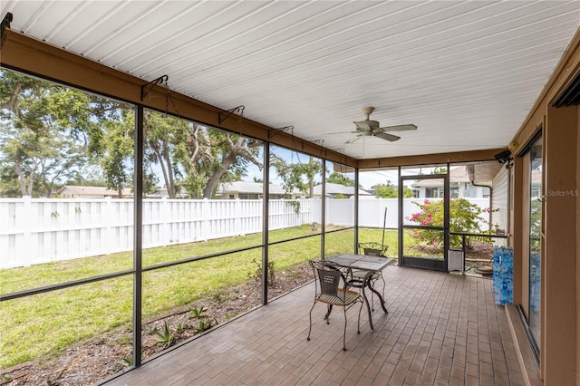 3242 Nocturne Rd, Venice, FL 34293 - unfurnished sunroom featuring ceiling fan and outdoor dining area