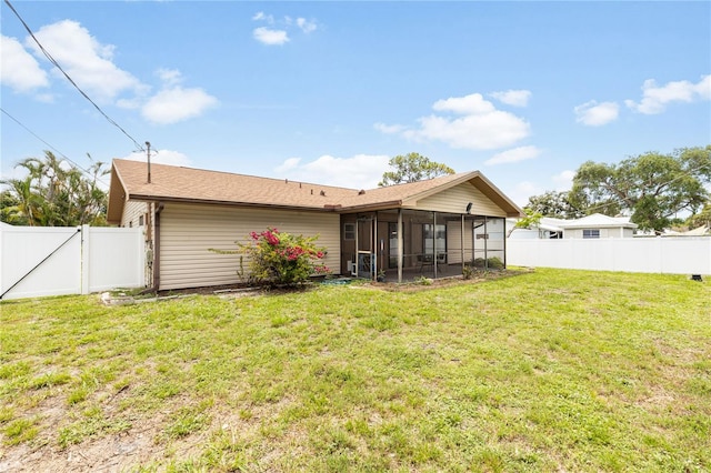 3242 Nocturne Rd, Venice, FL 34293 - rear view of house with a sunroom, a gate, and a fenced backyard