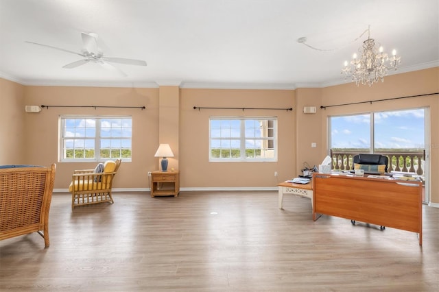 3730 Cadbury Cir Unit 616, Venice, FL 34293 - living area with plenty of natural light, crown molding, wood finished floors, a chandelier, and a desk