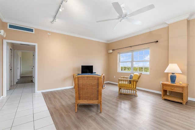 3730 Cadbury Cir Unit 616, Venice, FL 34293 - sitting room featuring ornamental molding, light wood finished floors, a ceiling fan, baseboards, and rail lighting