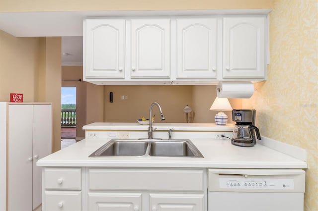 3730 Cadbury Cir Unit 616, Venice, FL 34293 - kitchen featuring wallpapered walls, a sink, white dishwasher, white cabinetry, and light countertops