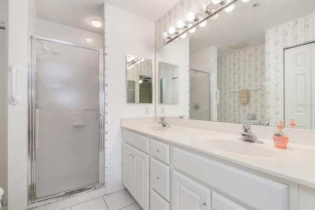 3730 Cadbury Cir Unit 616, Venice, FL 34293 - full bathroom with a shower stall, double vanity, wallpapered walls, and tile patterned floors