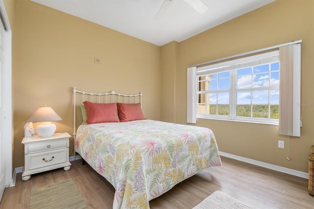 3730 Cadbury Cir Unit 616, Venice, FL 34293 - bedroom with baseboards, wood finished floors, and a ceiling fan