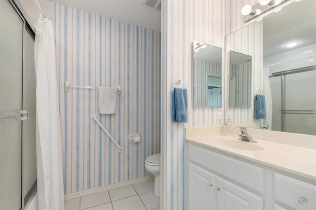 3730 Cadbury Cir Unit 616, Venice, FL 34293 - bathroom with wallpapered walls, a shower with curtain, tile patterned flooring, vanity, and toilet