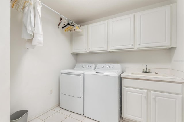 3730 Cadbury Cir Unit 616, Venice, FL 34293 - washroom with washing machine and dryer, cabinet space, and light tile patterned flooring