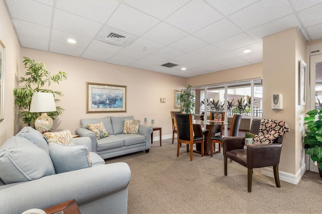 3730 Cadbury Cir Unit 616, Venice, FL 34293 - living area featuring a paneled ceiling, light colored carpet, baseboards, and recessed lighting