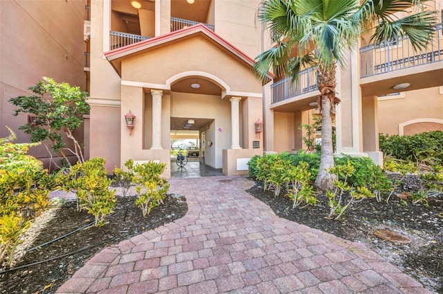 90 Vivante Blvd Unit 202, Punta Gorda, FL 33950 - view of exterior entry featuring stucco siding