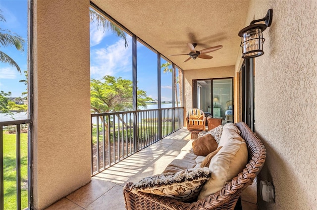 90 Vivante Blvd Unit 202, Punta Gorda, FL 33950 - sunroom / solarium featuring a ceiling fan, a water view, and healthy amount of natural light