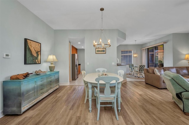 90 Vivante Blvd Unit 202, Punta Gorda, FL 33950 - dining space with a chandelier and light wood-style flooring