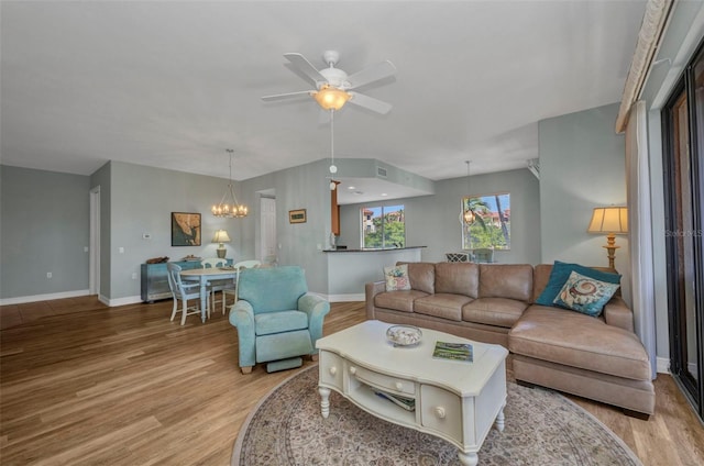 90 Vivante Blvd Unit 202, Punta Gorda, FL 33950 - living area featuring a chandelier, light wood-type flooring, and ceiling fan
