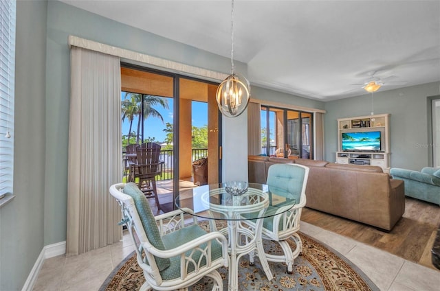 90 Vivante Blvd Unit 202, Punta Gorda, FL 33950 - dining space featuring a chandelier, a ceiling fan, and tile patterned floors