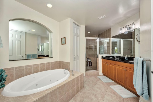 90 Vivante Blvd Unit 202, Punta Gorda, FL 33950 - full bath with a whirlpool tub, vanity, a shower stall, tile patterned flooring, and recessed lighting