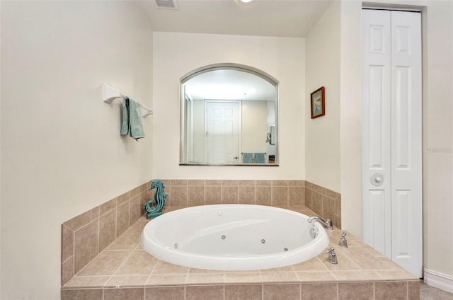 90 Vivante Blvd Unit 202, Punta Gorda, FL 33950 - bathroom with a closet and a whirlpool tub