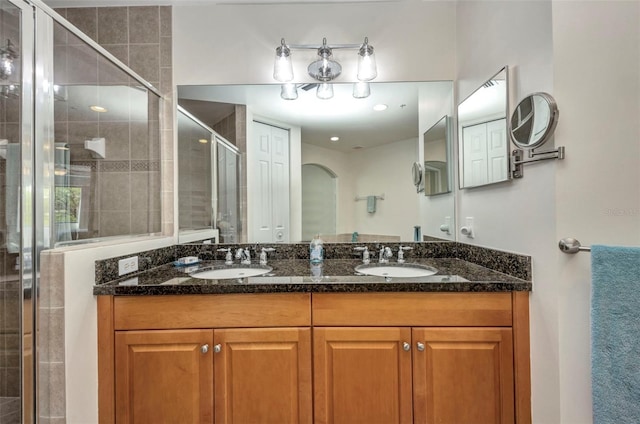 90 Vivante Blvd Unit 202, Punta Gorda, FL 33950 - bathroom featuring double vanity and a stall shower