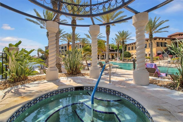 90 Vivante Blvd Unit 202, Punta Gorda, FL 33950 - community pool with a community hot tub and a patio area