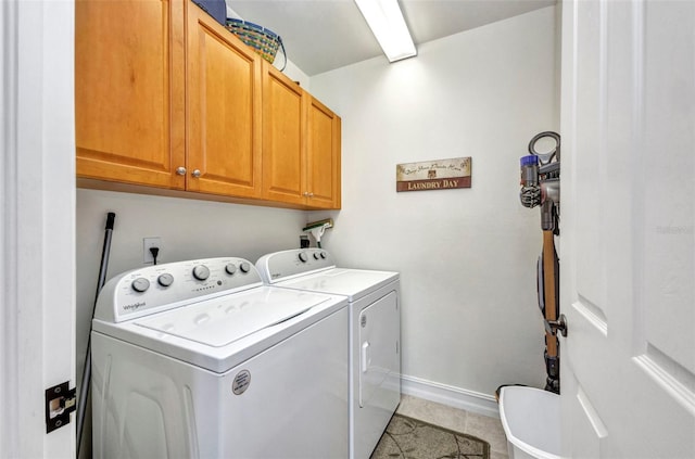 90 Vivante Blvd Unit 202, Punta Gorda, FL 33950 - washroom featuring cabinet space, independent washer and dryer, and light tile patterned floors