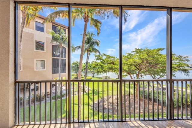 90 Vivante Blvd Unit 202, Punta Gorda, FL 33950 - unfurnished sunroom featuring a water view and healthy amount of natural light