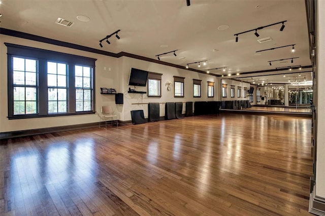 90 Vivante Blvd Unit 202, Punta Gorda, FL 33950 - misc room with rail lighting, wood finished floors, and crown molding