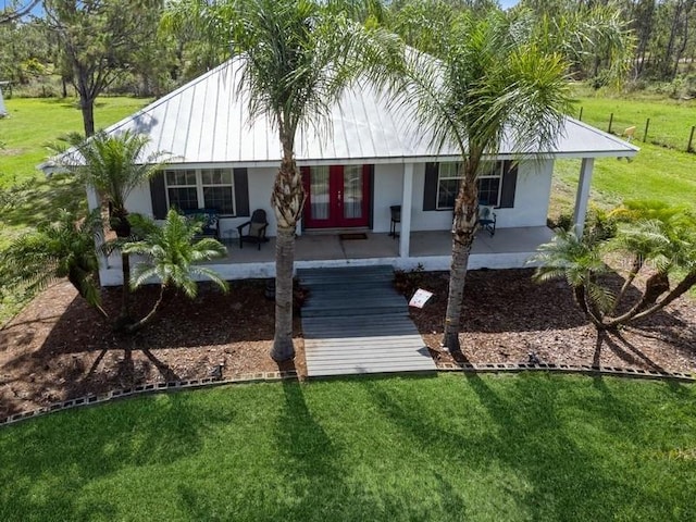 7424 Acorn Blvd, Punta Gorda, FL 33982 - ranch-style house featuring a porch, a front lawn, and stucco siding