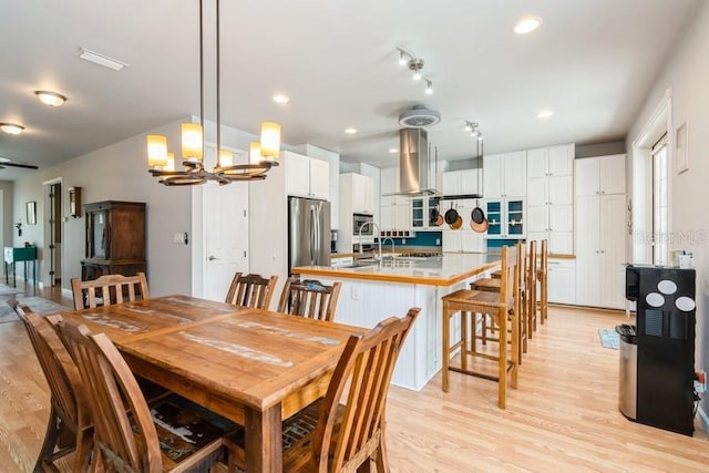 7424 Acorn Blvd, Punta Gorda, FL 33982 - dining area featuring a chandelier, light wood-style flooring, and recessed lighting