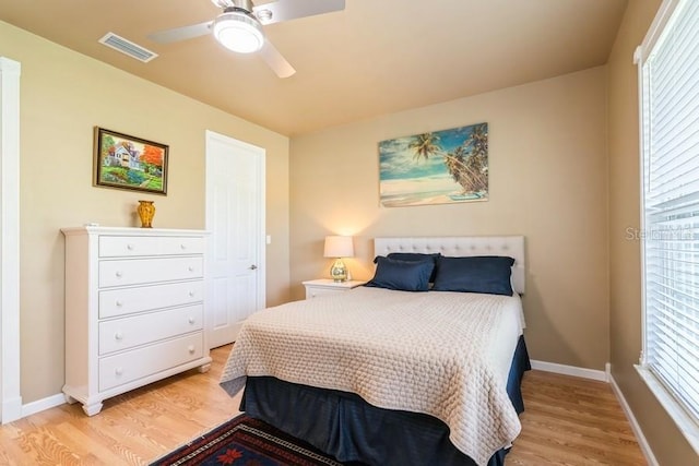 7424 Acorn Blvd, Punta Gorda, FL 33982 - bedroom with light wood finished floors, baseboards, and ceiling fan