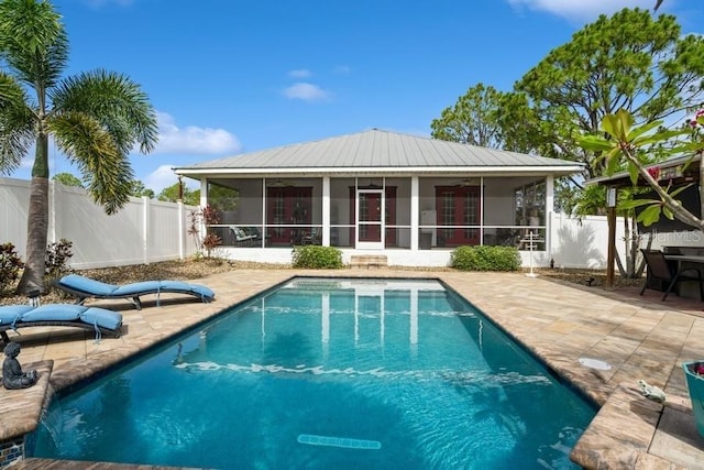 7424 Acorn Blvd, Punta Gorda, FL 33982 - rear view of property featuring a sunroom, ceiling fan, a fenced backyard, and a patio