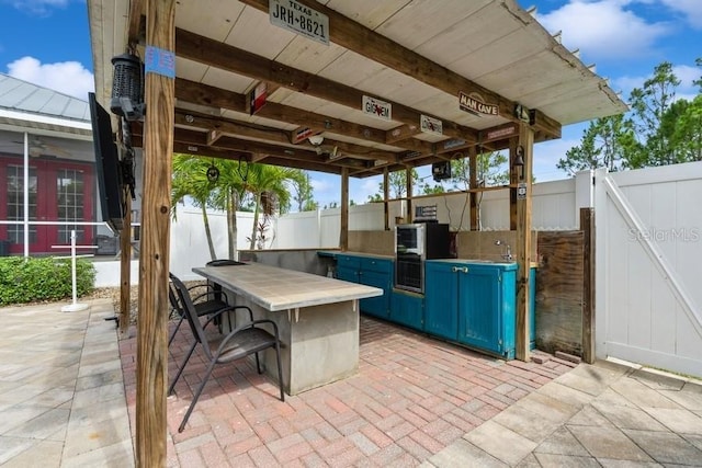 7424 Acorn Blvd, Punta Gorda, FL 33982 - view of patio with an outdoor kitchen and french doors