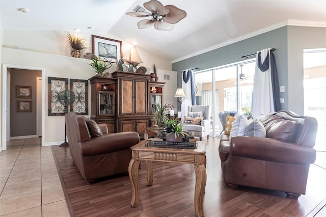 17150 Sarong Ln, Punta Gorda, FL 33955 - living area featuring ceiling fan, ornamental molding, light tile patterned floors, and high vaulted ceiling