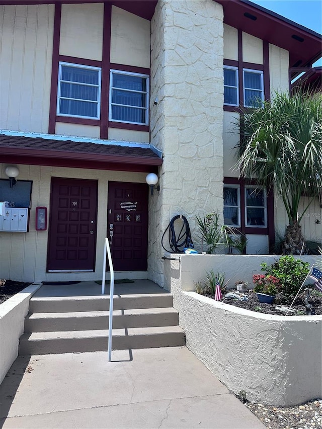 93 Boundary Blvd Unit 303, Rotonda West, FL 33947 - doorway to property featuring a garage
