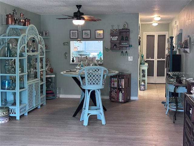 93 Boundary Blvd Unit 303, Rotonda West, FL 33947 - dining room featuring ceiling fan, wood finished floors, and baseboards