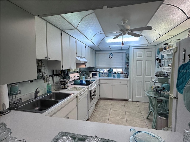 93 Boundary Blvd Unit 303, Rotonda West, FL 33947 - kitchen with white appliances, a sink, under cabinet range hood, ceiling fan, and white cabinetry