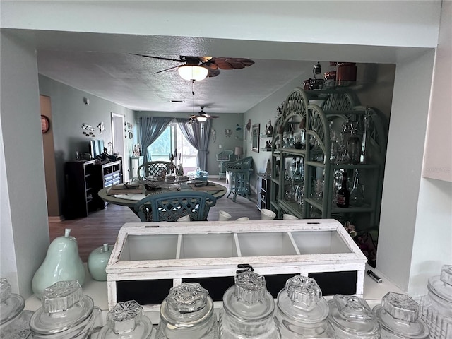 93 Boundary Blvd Unit 303, Rotonda West, FL 33947 - dining area featuring ceiling fan and wood finished floors