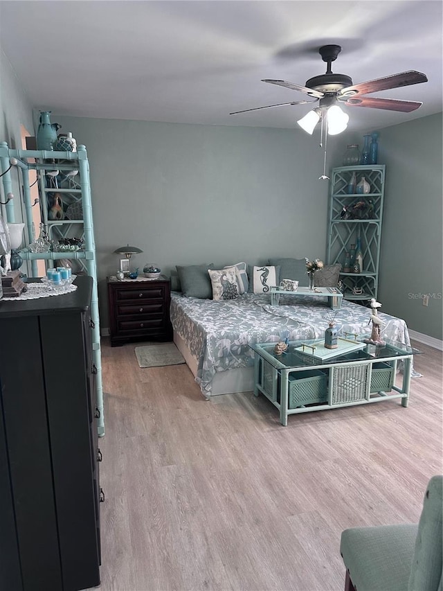 93 Boundary Blvd Unit 303, Rotonda West, FL 33947 - bedroom with light wood-type flooring and ceiling fan