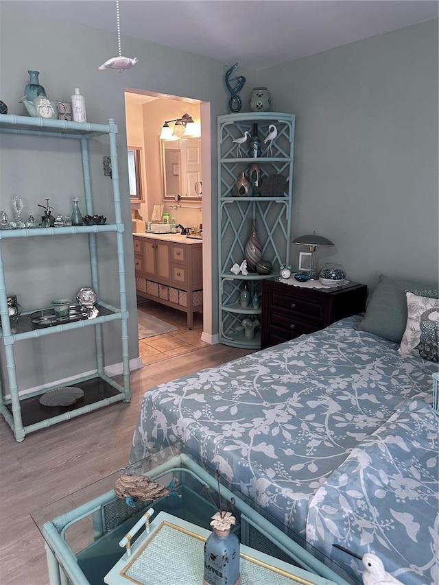 93 Boundary Blvd Unit 303, Rotonda West, FL 33947 - bedroom with wood finished floors and ensuite bath