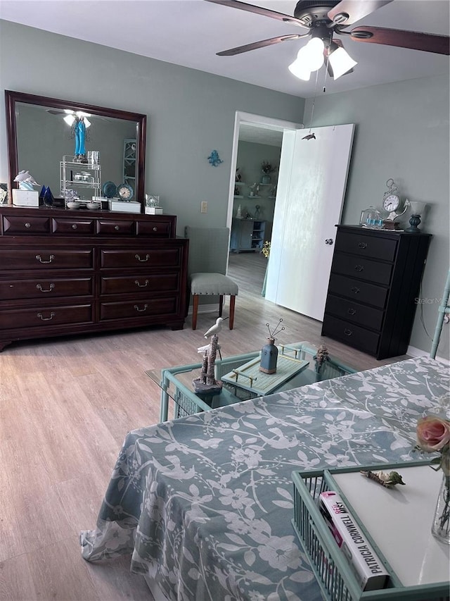 93 Boundary Blvd Unit 303, Rotonda West, FL 33947 - bedroom featuring light wood-style floors and a ceiling fan