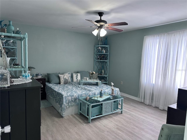 93 Boundary Blvd Unit 303, Rotonda West, FL 33947 - bedroom featuring light wood finished floors and a ceiling fan