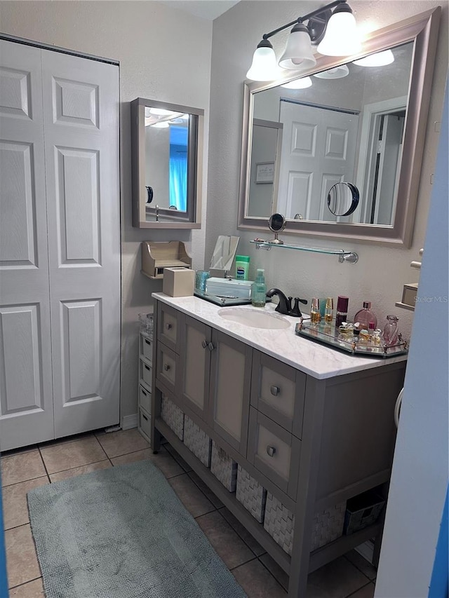 93 Boundary Blvd Unit 303, Rotonda West, FL 33947 - bathroom with tile patterned floors and vanity
