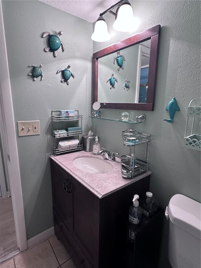 93 Boundary Blvd Unit 303, Rotonda West, FL 33947 - half bathroom featuring vanity, tile patterned floors, and toilet