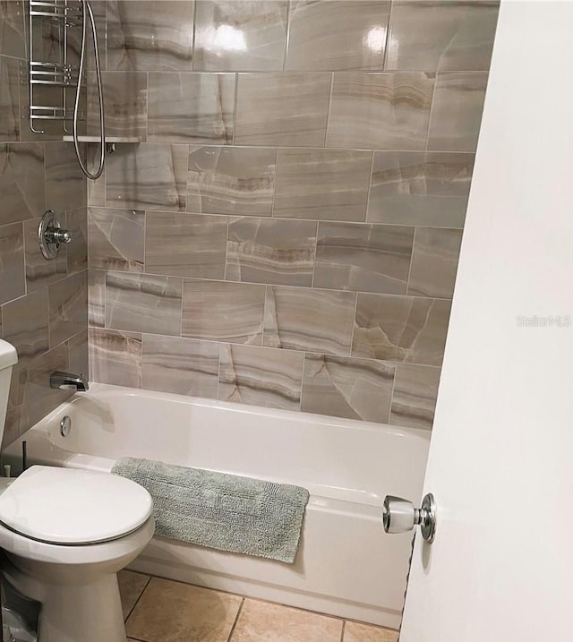 93 Boundary Blvd Unit 303, Rotonda West, FL 33947 - full bath featuring tile patterned flooring, toilet, and shower / washtub combination