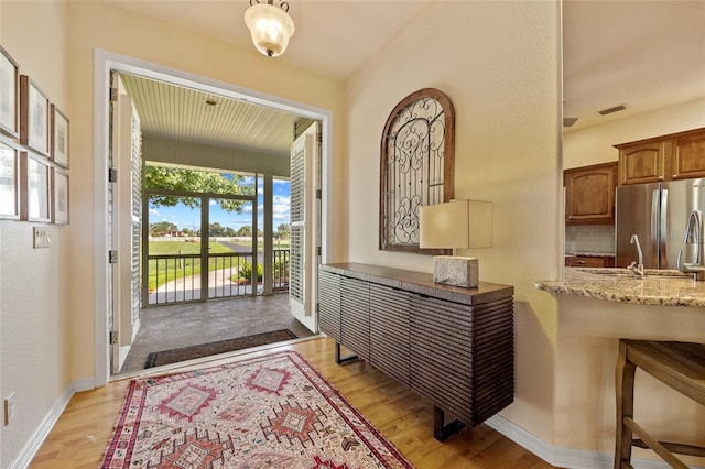 5221 Blackjack Cir, Punta Gorda, FL 33982 - foyer entrance with light wood-style flooring and a textured wall