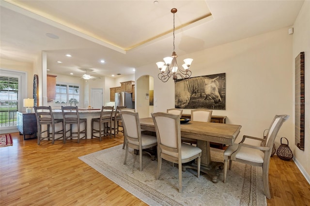 5221 Blackjack Cir, Punta Gorda, FL 33982 - dining space featuring light wood-style floors, arched walkways, a chandelier, ceiling fan, and recessed lighting