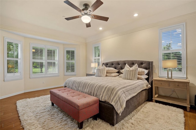 5221 Blackjack Cir, Punta Gorda, FL 33982 - bedroom with wood finished floors, multiple windows, recessed lighting, ceiling fan, and ornamental molding