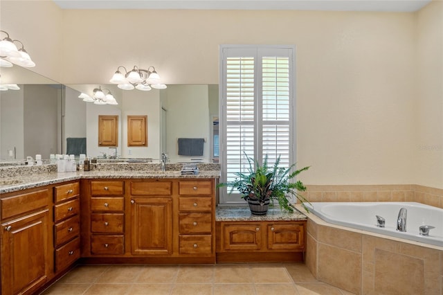 5221 Blackjack Cir, Punta Gorda, FL 33982 - full bath with a chandelier, a bath, double vanity, and tile patterned floors