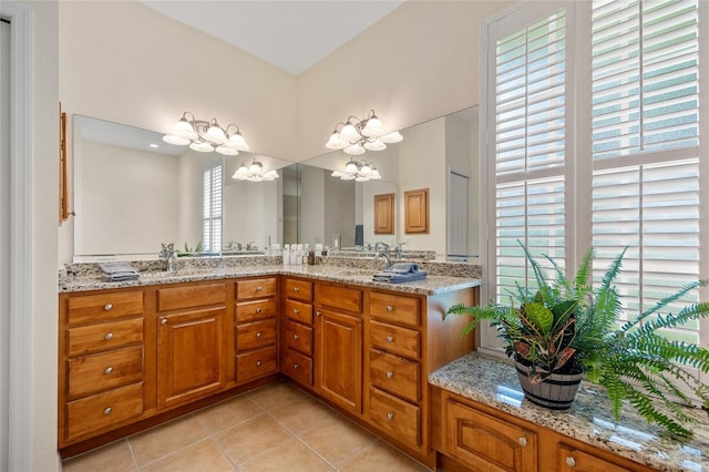 5221 Blackjack Cir, Punta Gorda, FL 33982 - full bathroom featuring tile patterned flooring, a chandelier, and double vanity