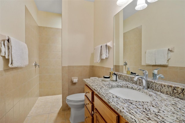 5221 Blackjack Cir, Punta Gorda, FL 33982 - full bathroom featuring a walk in shower, vanity, tile patterned floors, and tile walls