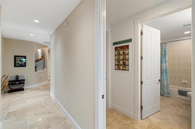 2630 Tarpon Cove Dr Unit 212, Punta Gorda, FL 33950 - hallway featuring recessed lighting, light tile patterned flooring, and baseboards