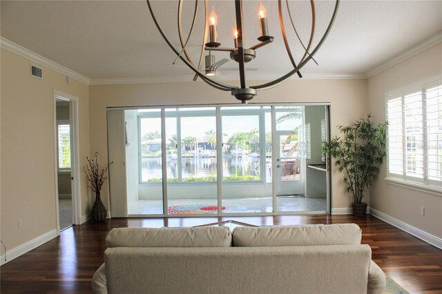 2630 Tarpon Cove Dr Unit 212, Punta Gorda, FL 33950 - living area with a chandelier, healthy amount of natural light, wood finished floors, and ornamental molding