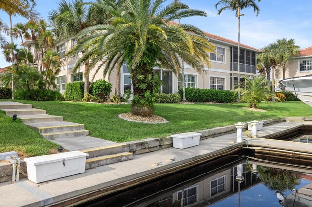 2630 Tarpon Cove Dr Unit 212, Punta Gorda, FL 33950 - back of house with a yard and stucco siding