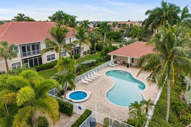 2630 Tarpon Cove Dr Unit 212, Punta Gorda, FL 33950 - community pool featuring a fenced backyard and a patio